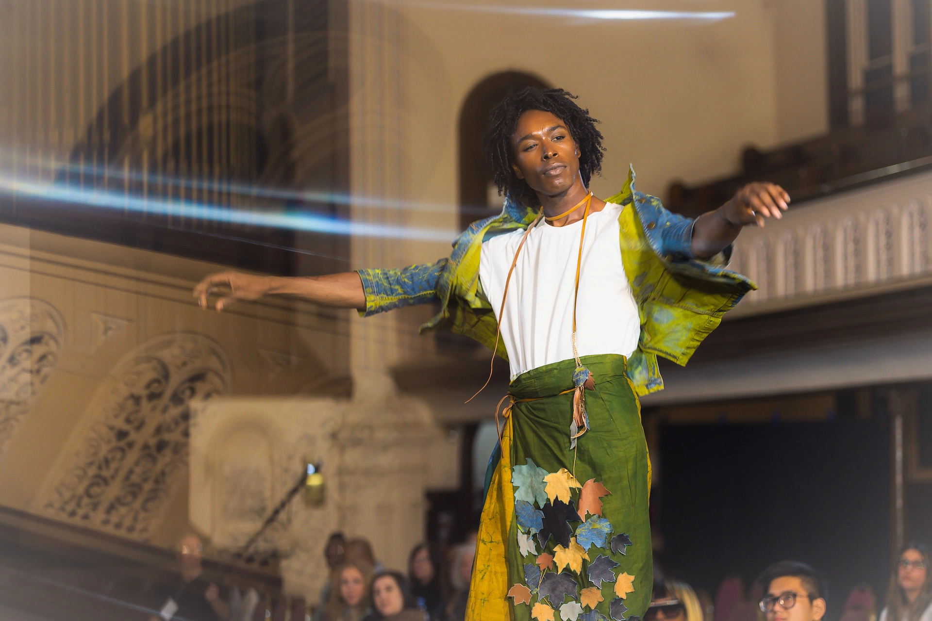  A handsome mixed-race model showcasing a local designer's creation on the runway at Hamilton Fashion Week.