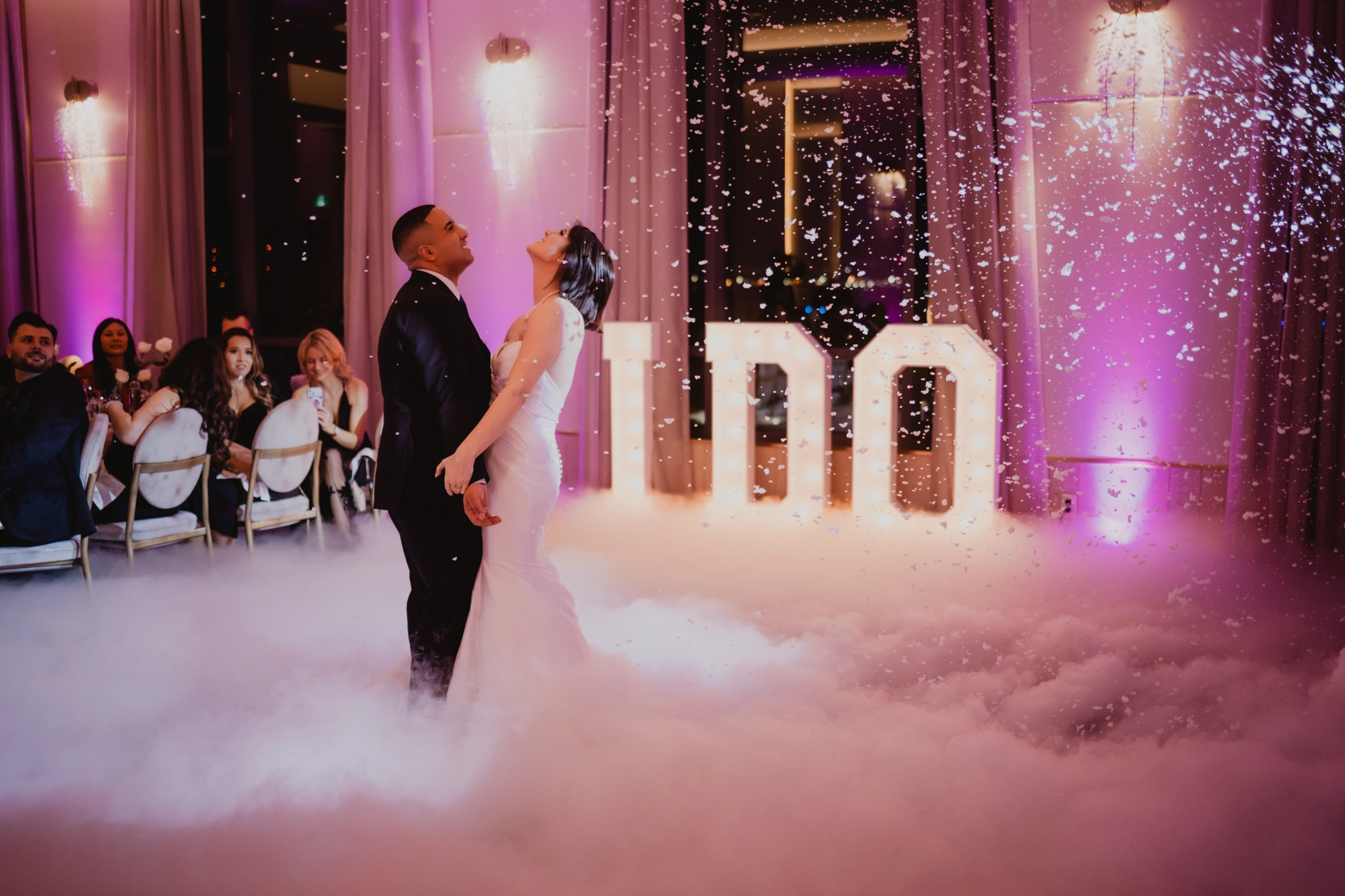 A romantic moment as the couple shares their first dance surrounded by atmospheric smoke at The Pearle, captured by Brantford wedding photographer Alissa Baltazar serving Hamilton, Cambridge, and surrounding Southern Ontario areas.