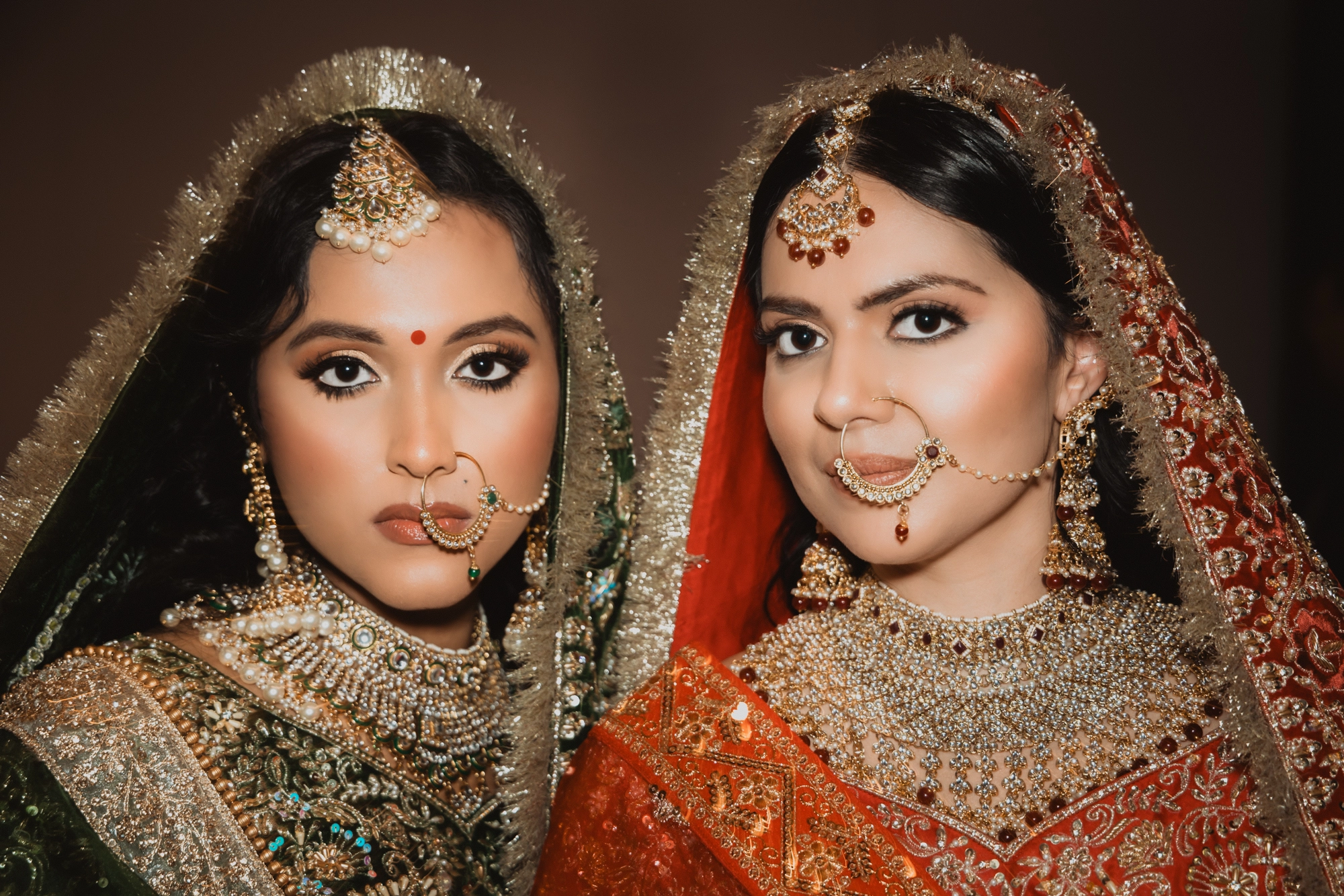 Beautiful close-up of two girls dressed in vibrant Indian outfits, showcasing colorful and joyful moments at a Southern Ontario wedding.