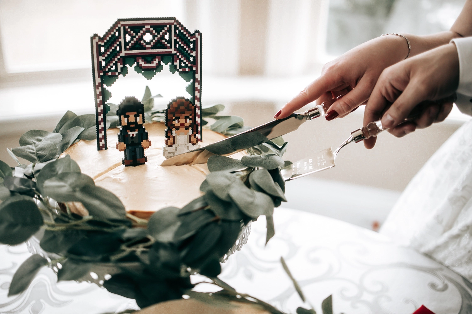 A bold, custom-designed wedding cake for a couple who bonded over gaming, adding personality and playfulness to their Southern Ontario celebration.