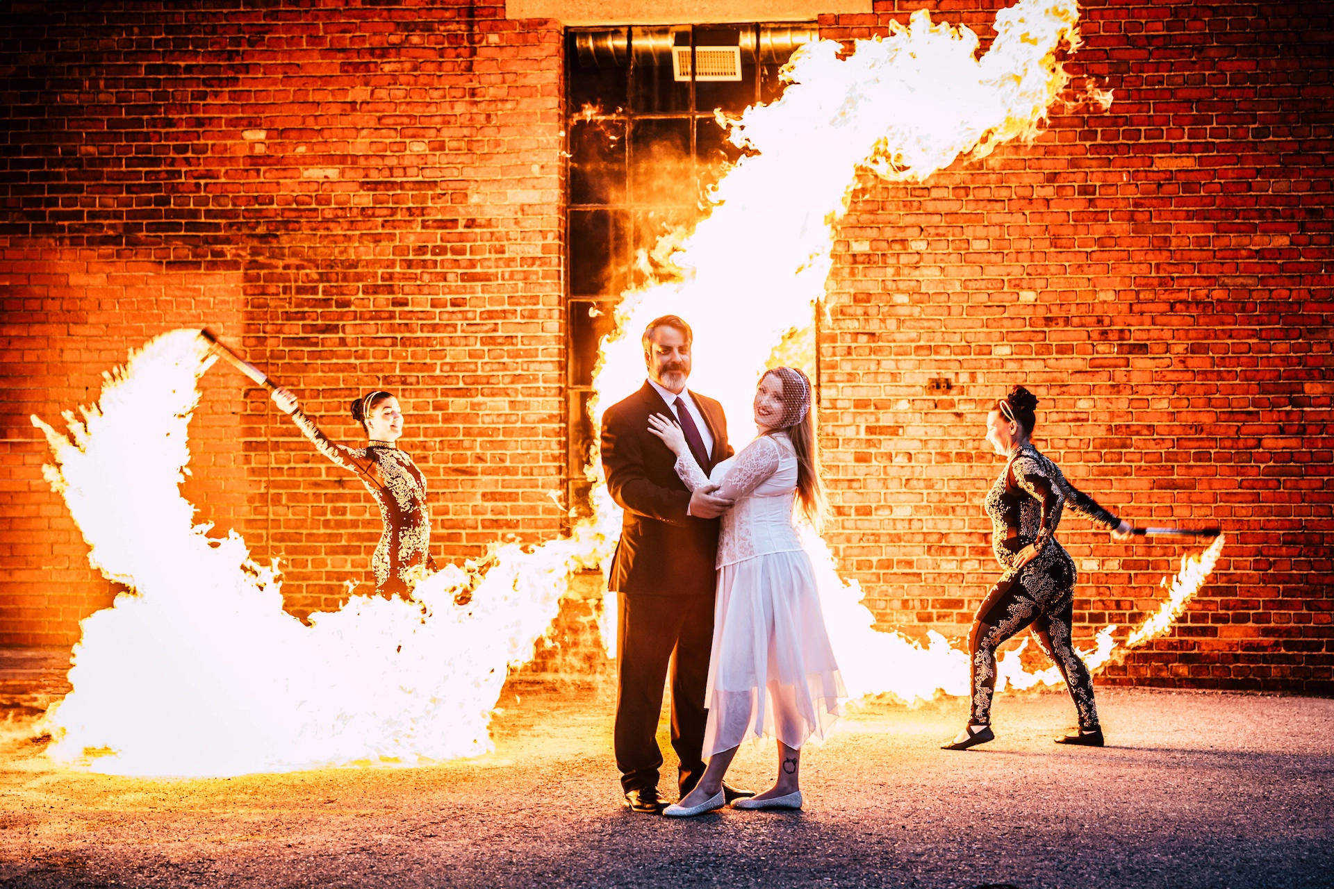 A spectacular moment as fire dancers surround a wedding couple with blazing swooshes of flame during their Southern Ontario celebration.
