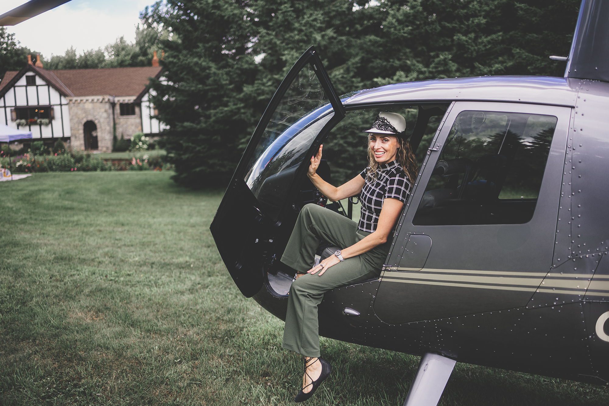 Wedding magazine editor inside a helicopter, covering a unique wedding experience in an exclusive interview.