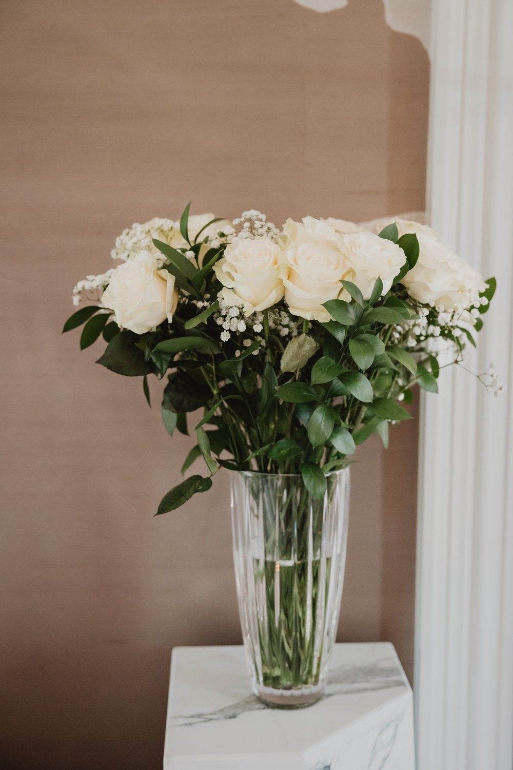 A romantic roses bridal bouquet photographed during a micro wedding held at Sarah St. Amand’s beautifully designed Brantford studio.