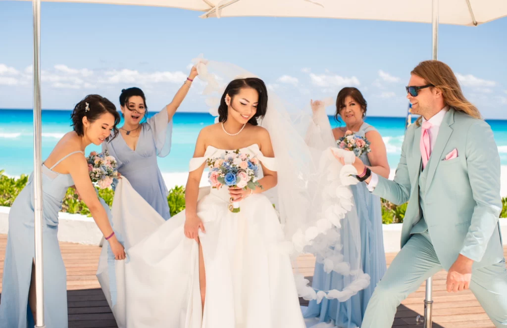 Bride with her bridesmaids before her Mexico beach wedding