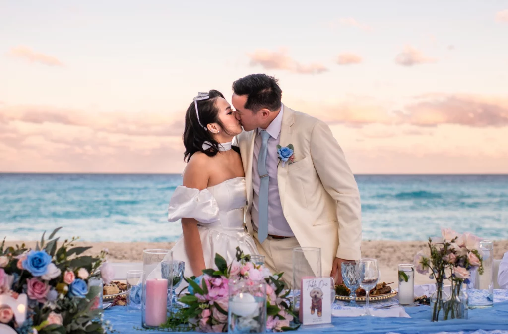 Romantic sunset kiss at a Mexican beach wedding