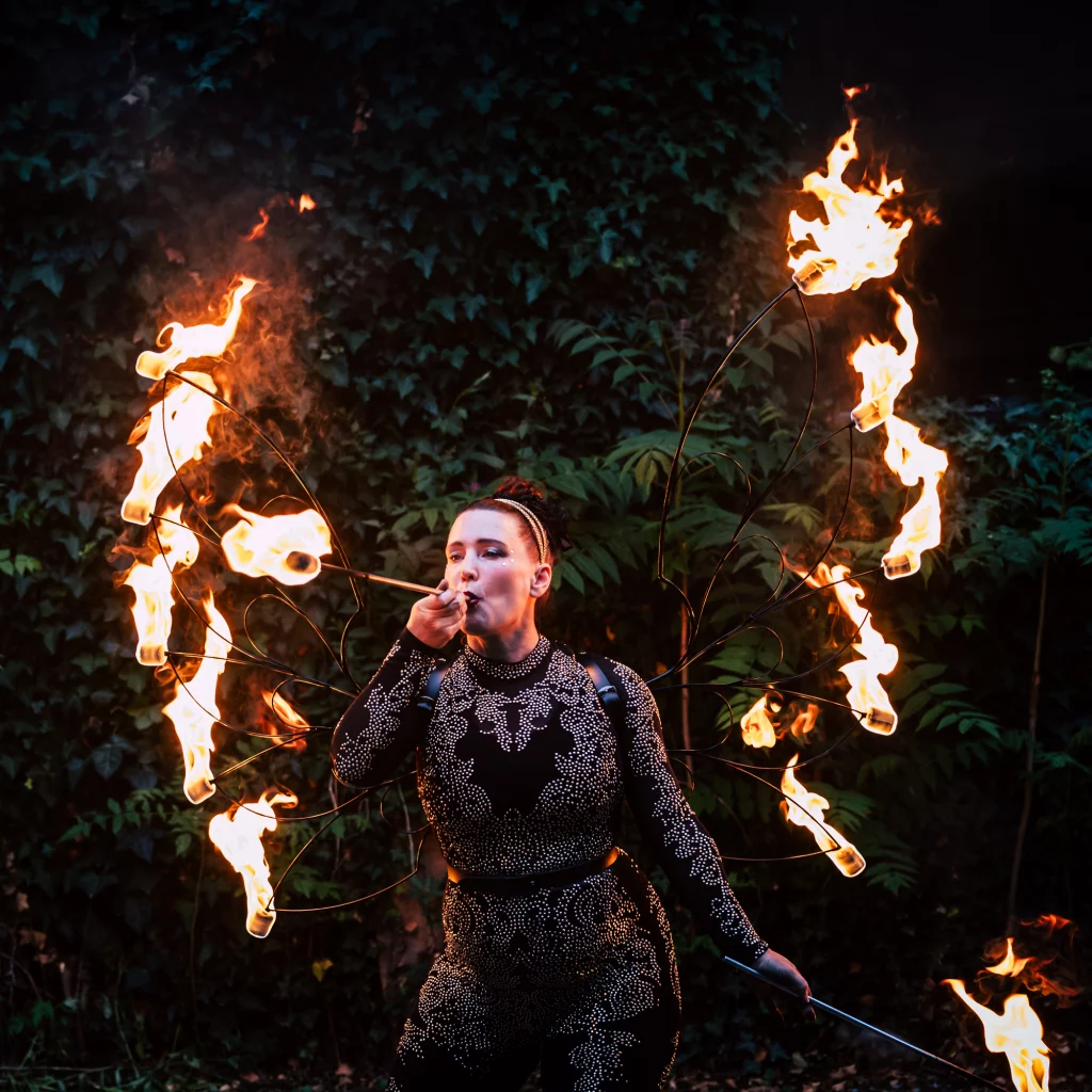 Hoop You fire dancer performing with flames during a fire show wedding
