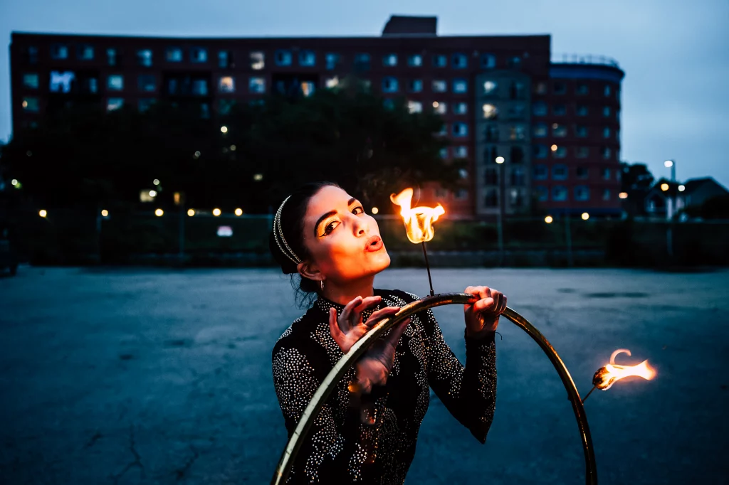 Solo fire dancer performing a synchronized fire dancing show, creating dramatic wedding entertainment for guests