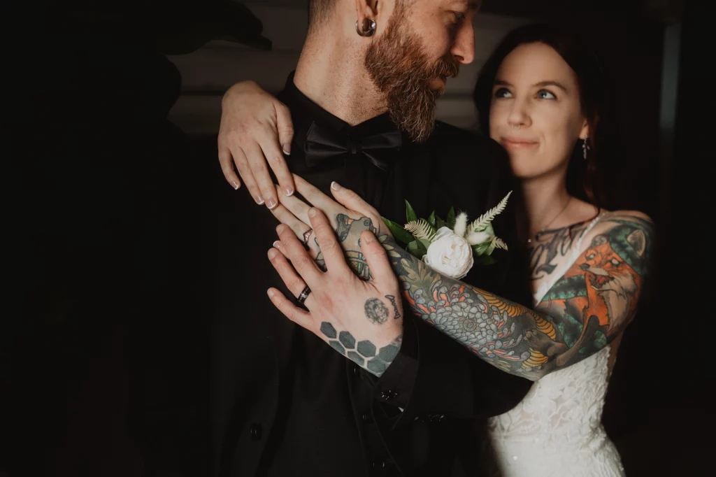 Amazing close up wedding portrait of the tatooed couple.