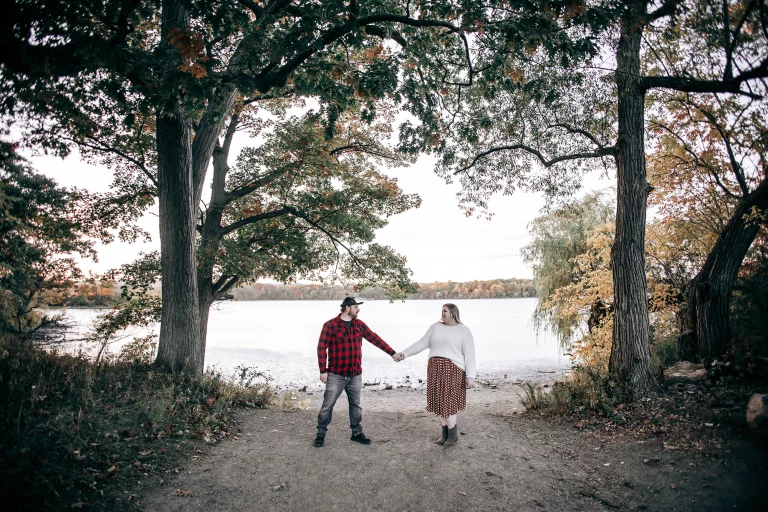 Madelaine and Nicholas engagement photos at Princess Point Hamilton during fall sunset with golden leaves and waterfront views