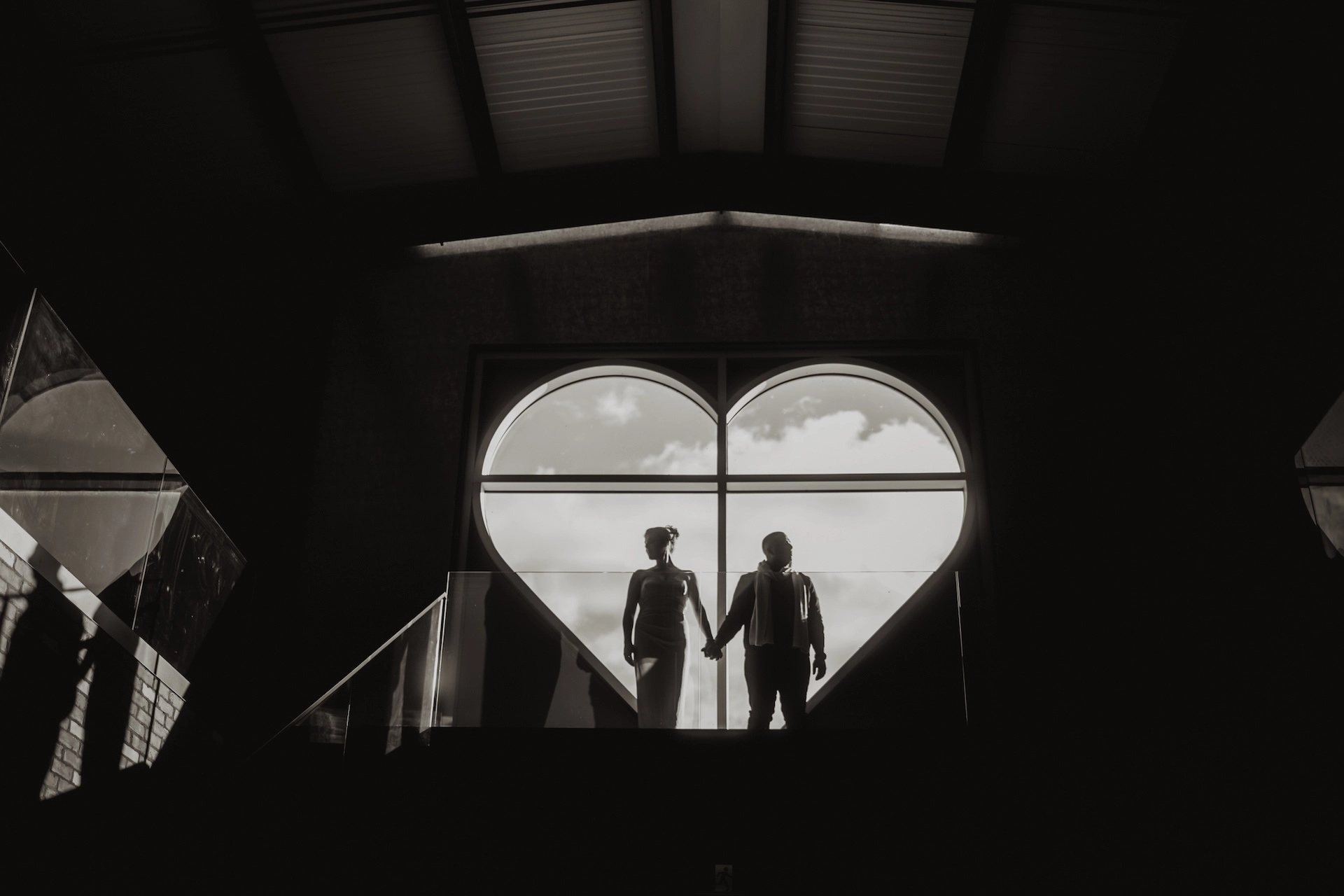 Romantic black and white silhouette of a couple photographed during an engagement session.
